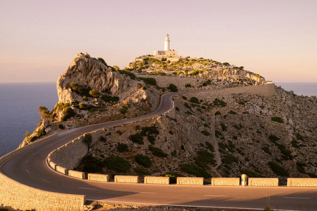 white and brown concrete building on top of mountain during daytime